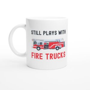 Still Plays with Fire Trucks | Funny Firefighter Mug