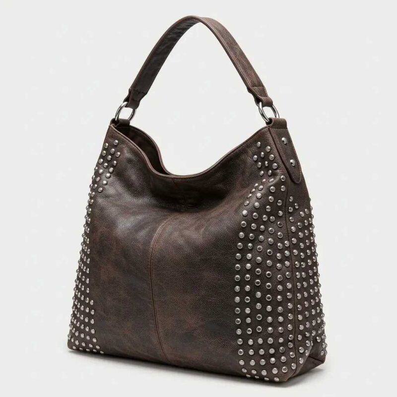 Dark brown leather hobo bag: silver studs, roomy design, single strap—an effortless blend of rocker glam and chic style.