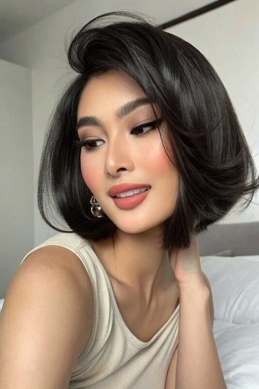 A young woman with the Old Money Bob hairstyle.