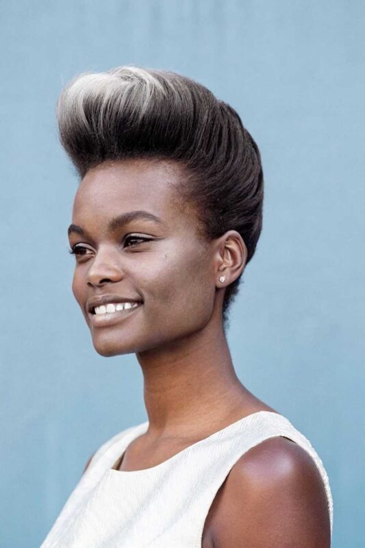A young woman with pompadour hairstyle.