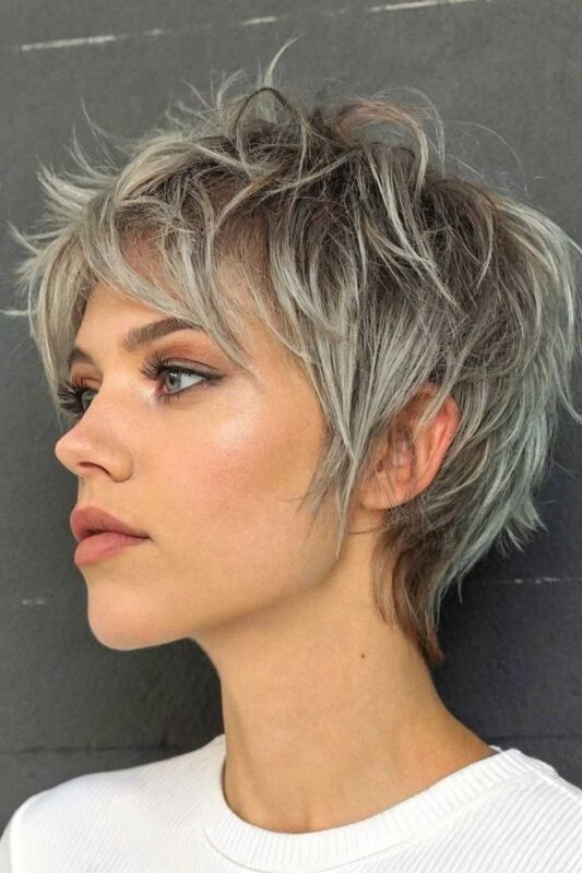 A woman with a short summer shag hairstyle.