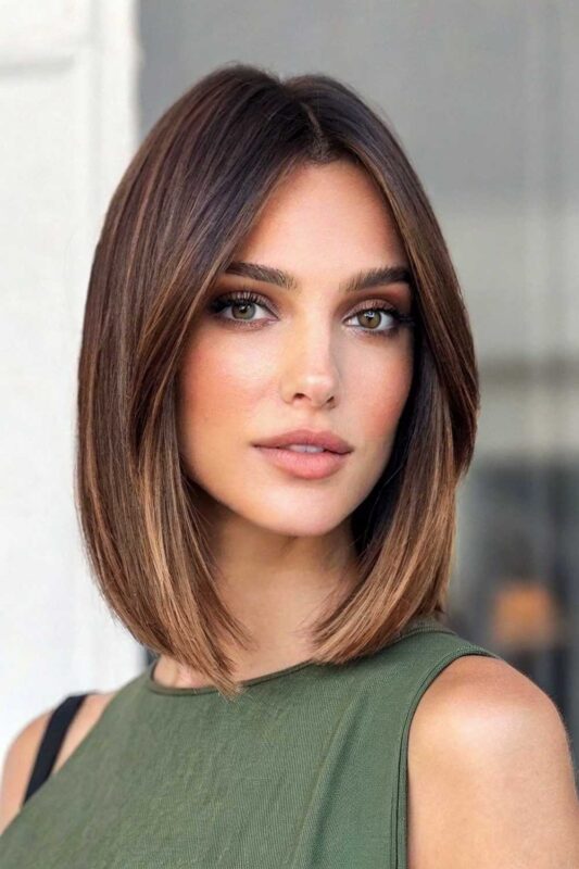 A woman with a blunt collarbone cut hairstyle.