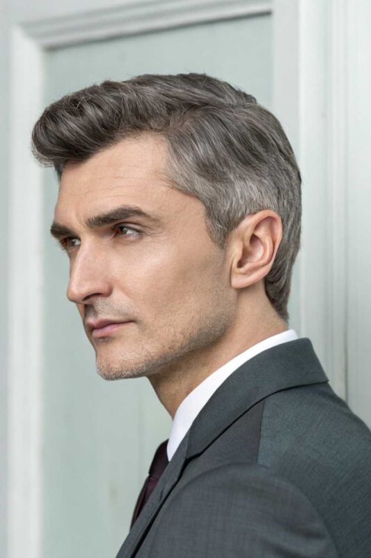 An older man with Ivy League hairstyle.