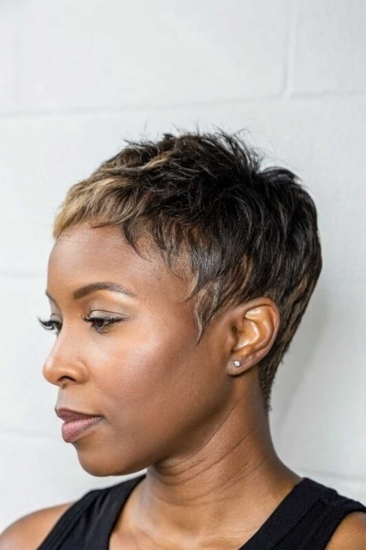 A woman with a Micro Pixie hairstyle.