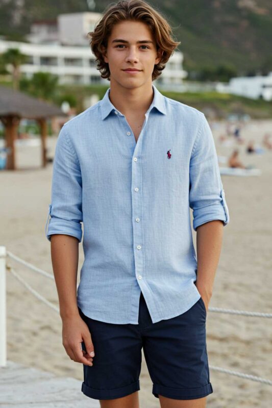 Teen boy wearing linen button-up shirt and chino shorts preppy summer outfit.
